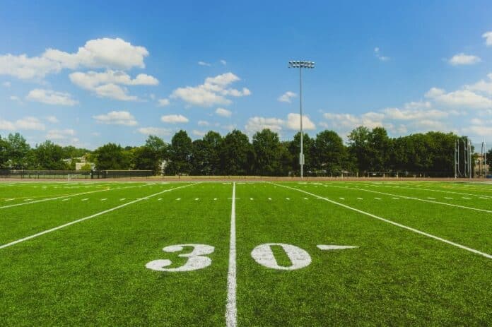 Soccer ball on the field of stadium