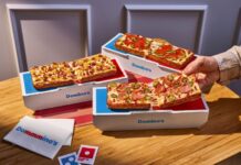 Domino’s Launches Personal Detroit-Style Pizza The Domino is made with premium, buttery-flavored pan dough encrusted with real Parmesan cheese and baked in a rectangular pan to create a crispy Parmesan Detroit-style crust. It is topped with two layers of cheese, customers' choice of sauce and up to three toppings, and finished with a drizzle of Domino's signature garlic seasoning.