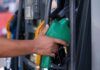 Tennessee Gas Prices Climb 11 Cents as Crude Oil Surges gas pump stock photo