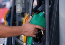 Tennessee Gas Prices Climb 11 Cents as Crude Oil Surges gas pump stock photo